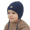 Chlapecká zimní čepice, tmavě modrá, zavazovací, 100% merino vlněná, podšitá merino fleece, Buno